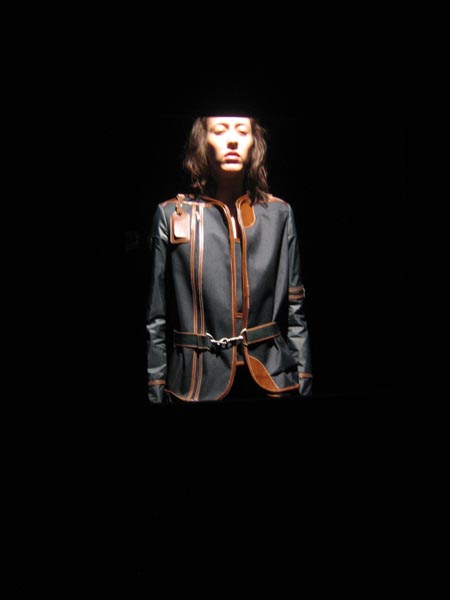 8fromASVOF This picture came from Diane Pernet's A Shaded View On Fashion (another one of my favorite blogs.) She included the following caption: "Travel Jacket: 53 hours to construct/5330 Euros The jacket is cut from a zipped nylon travel garment bag. What I loved was the breakdown: "The hours of work necessary for the creation in question includes: the preparation, the finishing and the quality control but exclude the researc of raw material, technical control, necessary treatment (cleaning, softening, dying, etc.) and the fittings. Travel Jacket - February. "