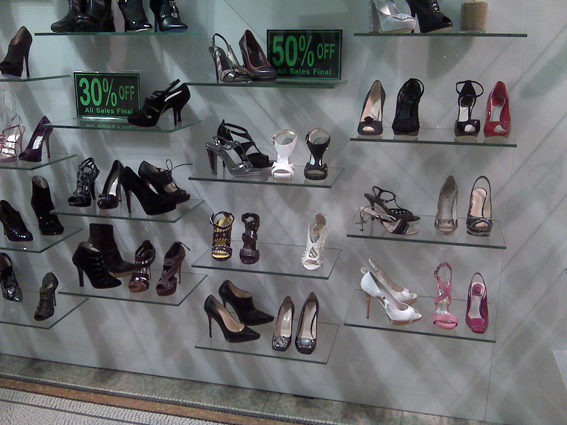 LeoneShoes This is a shoe rack with Jimmy Choo, Miu Miu, Dior and other fabulous luxury shoes. They are displayed the same way you woudl display $29.99 stripper shoes. I bought a pair in London once, and they were displayed exactly like this. Cna you imagein there must be at least 20,000 dolalrs worth of shoes on those cheap shelves...
