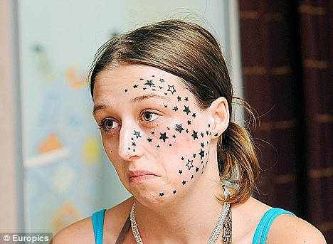 Belgian teen Kimberley Vlaminck with 56 stars tattooed on her face